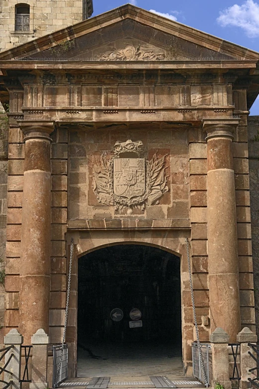 large brick building with ornate doorway on top