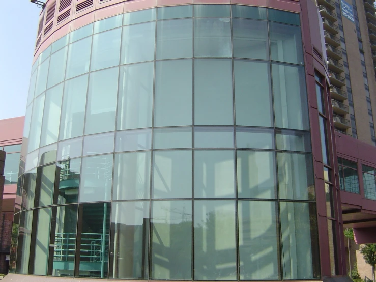 a circular building with some windows and a clock