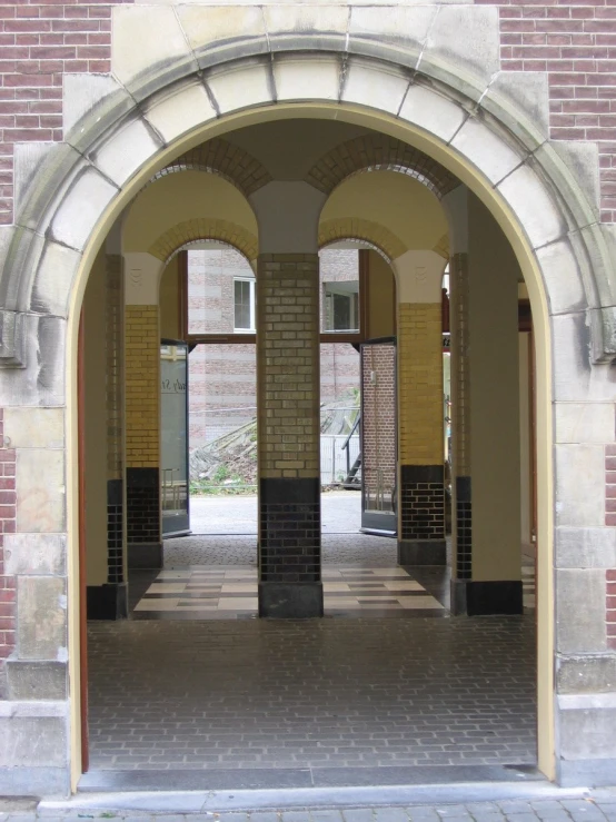 an arched doorway with three doorways and pillars