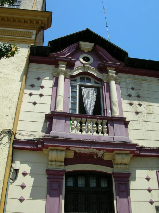 an old style window on the side of a building