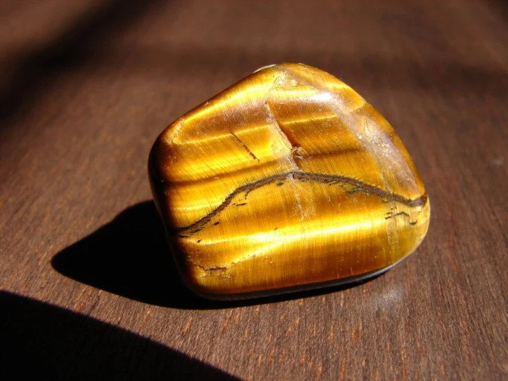 a large crystal like item sitting on top of a wooden table