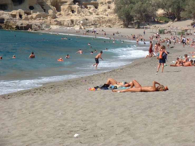 people enjoying the beach in an open area