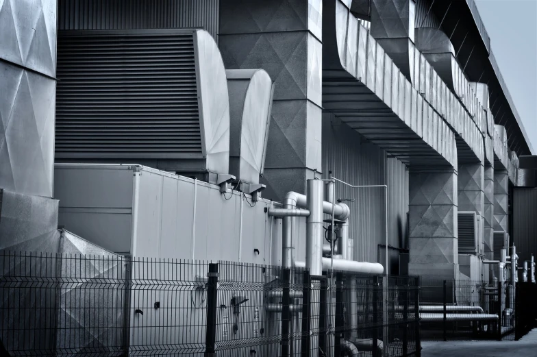 pipes attached to the outside of an industrial building