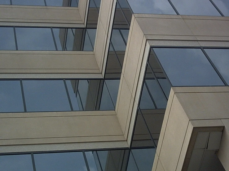 an abstract view of glass windows and a telephone pole