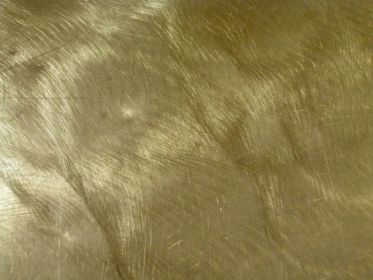 the shiny texture of a sheet of gold paper