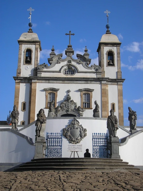 the architecture of an old church with statues on it