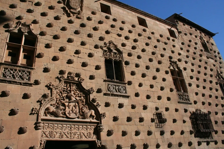 some ornate decoration on a large building on the street