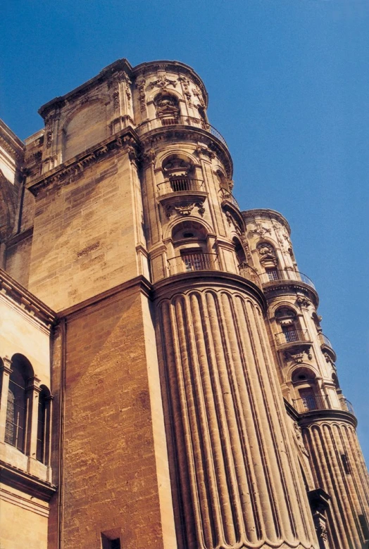 an upward view of a building with a clock