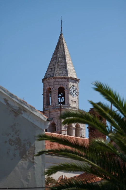 view of the roof of a building with a clock on it
