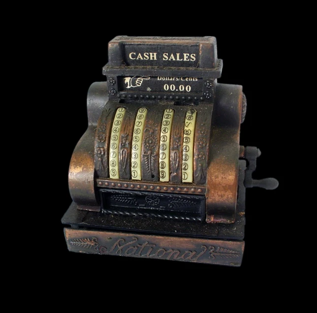 an antique cash register made from a wooden case