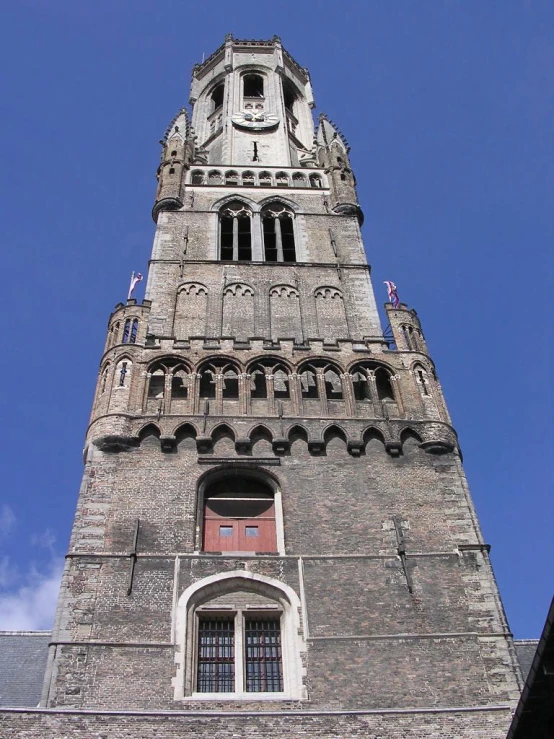 a very tall brick tower with some windows