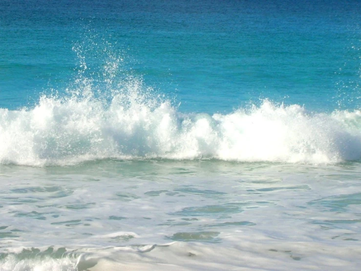 a surfer is catching the wave at the beach