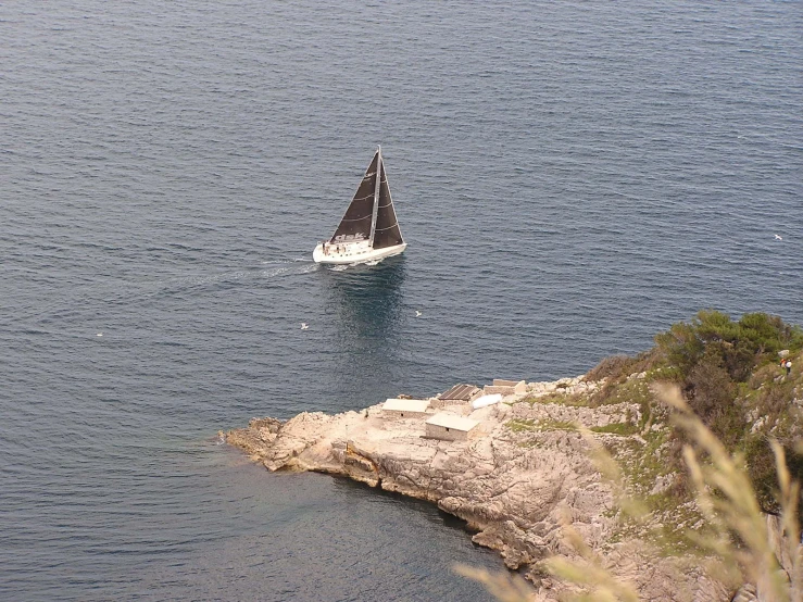 a small sailboat is in open water