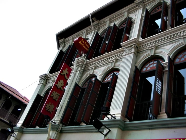 the front of a building has a bunch of red and white decorations