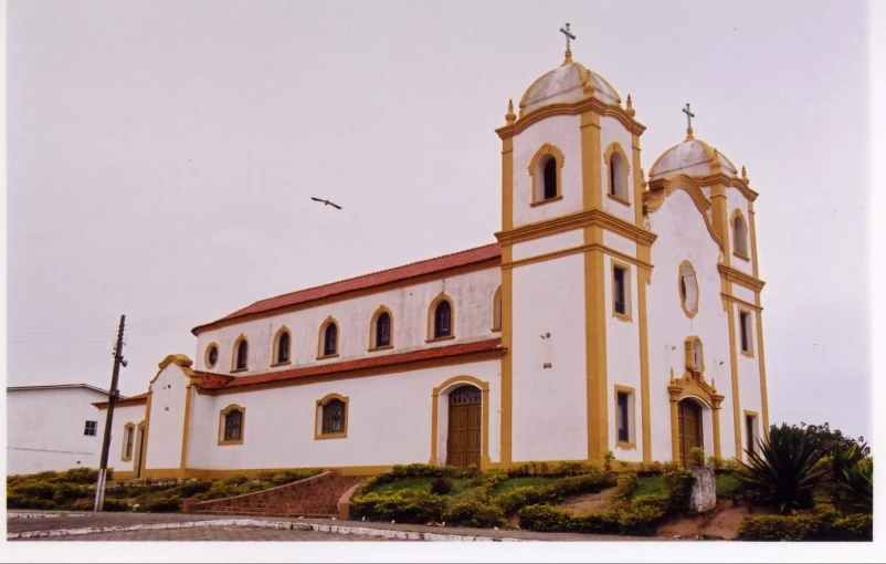 an old church with golden trim and arched windows