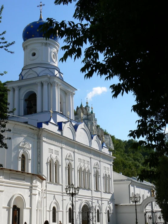 an old church with a cross on the roof