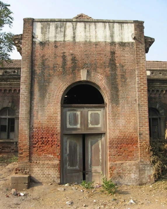 an old building with a stone archway and door