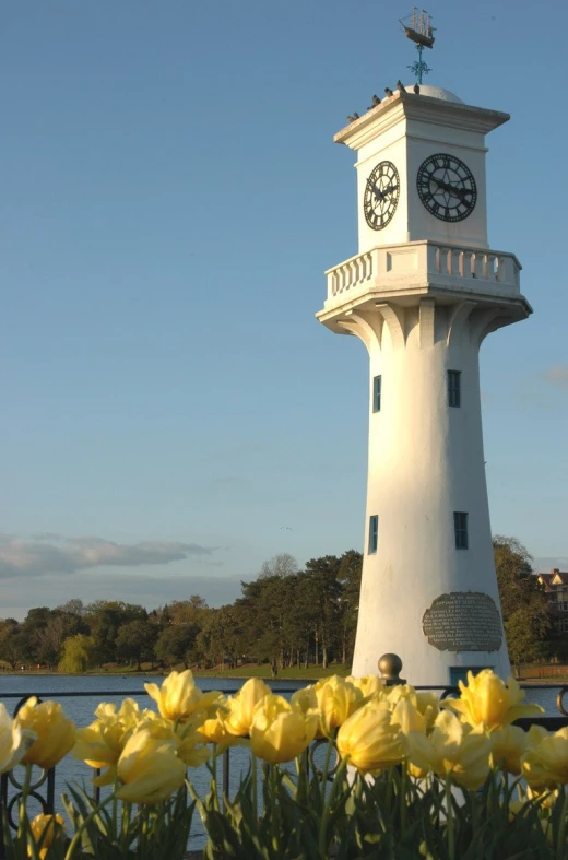 a clock tower that has a large white clock on it