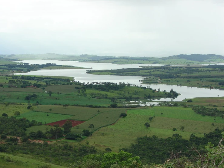 an aerial view shows a field and lake