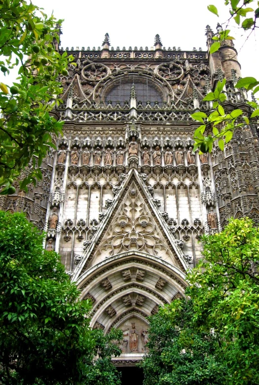 a very tall building with an arched window and a clock