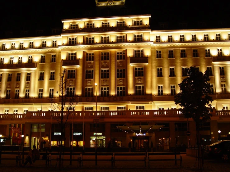 a large building illuminated up in the dark