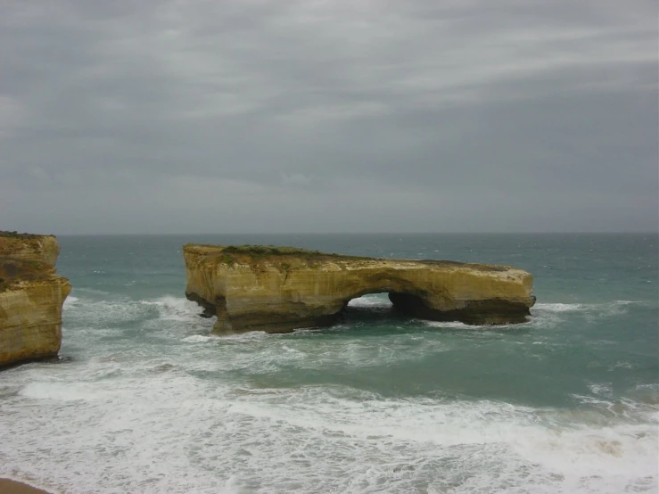 the two large rocks are close to the water