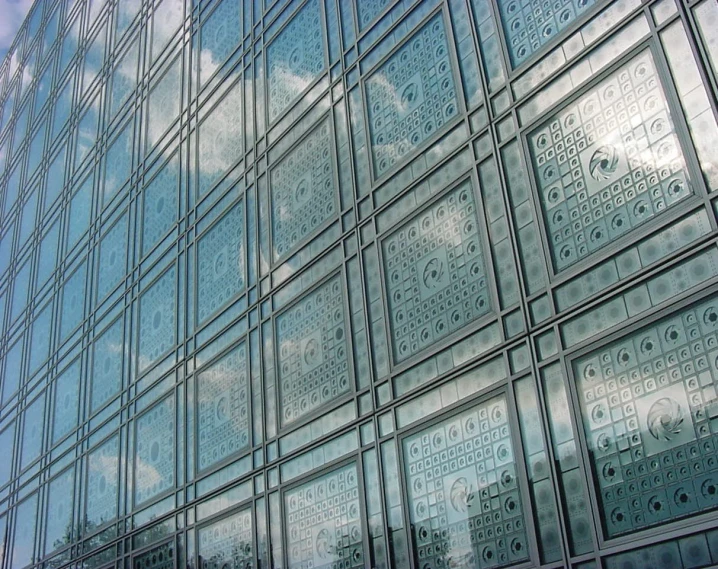 there is a very large glass building in the foreground