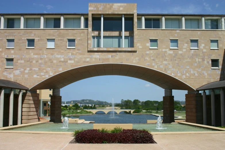 an open arch leads to an elegant fountain