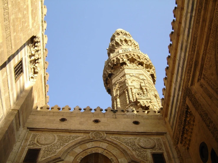 a clock tower is seen against the sky in the city