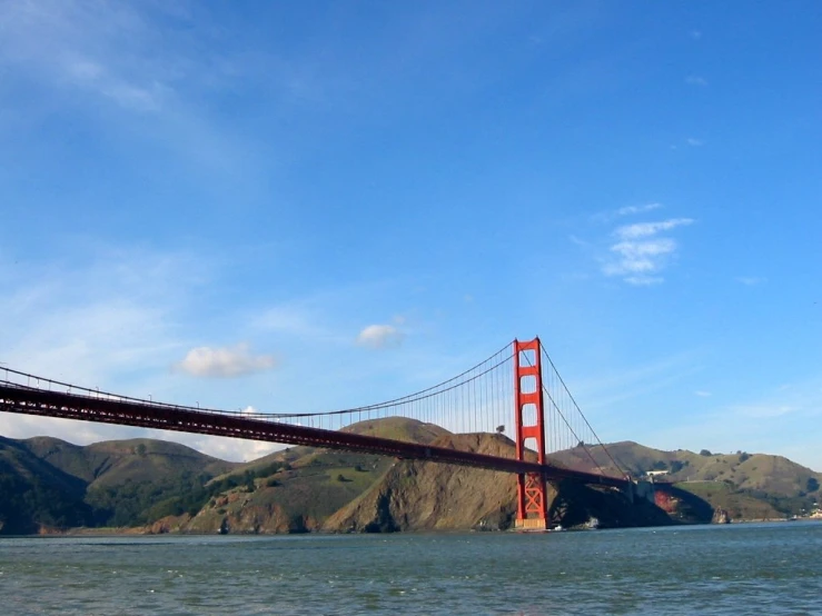 a view of the golden gate bridge from across the river