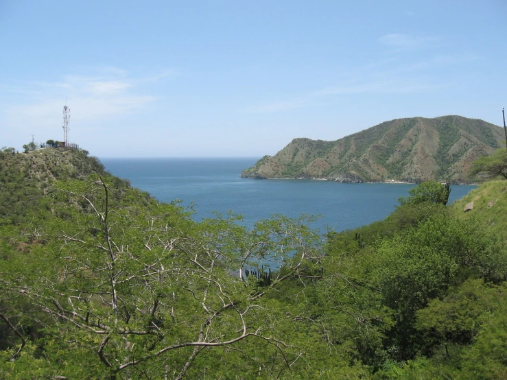 an image of mountains and blue water