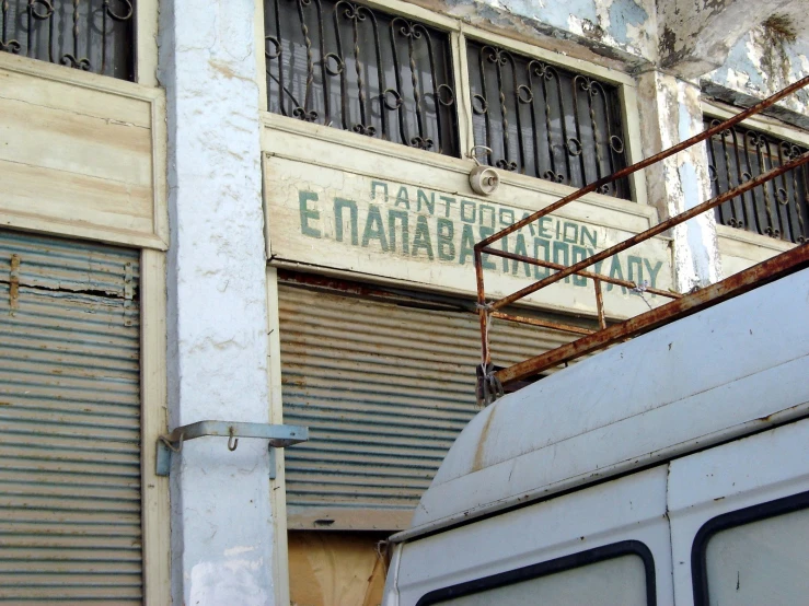 a street scene with an old van and building