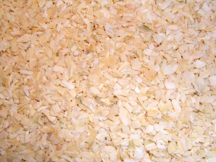 a pile of white rice sitting on top of a table