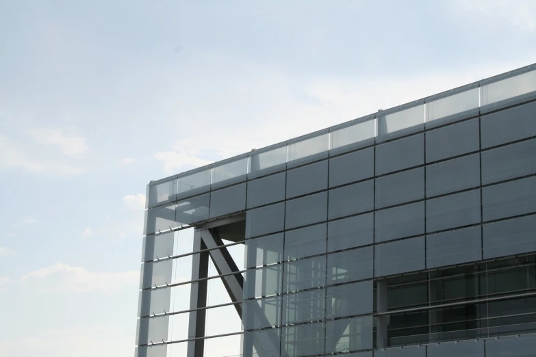 an exterior view of an office building with an arrow in front of it