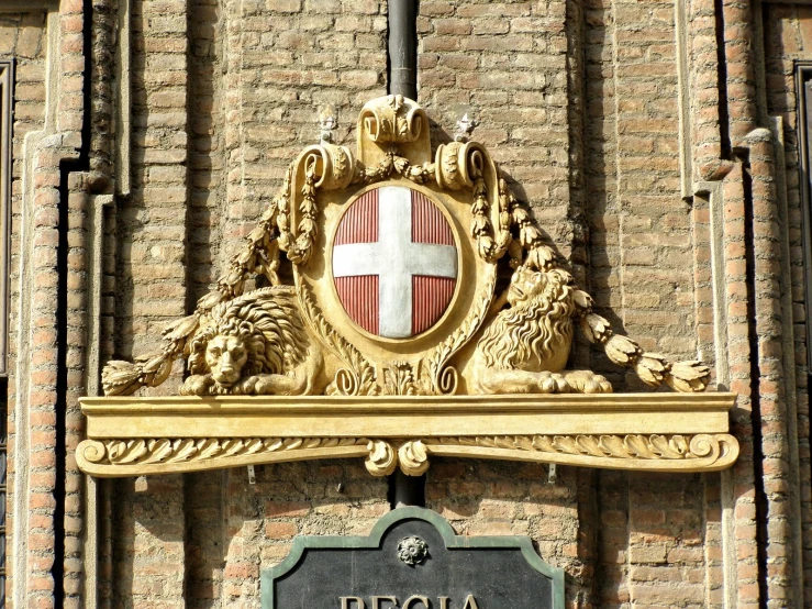 a large coat of arms on the side of a building