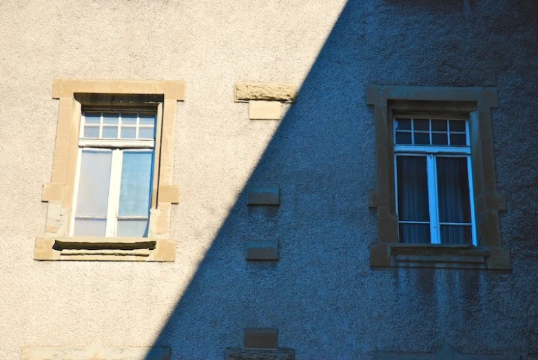 the shadow of two windows of a building