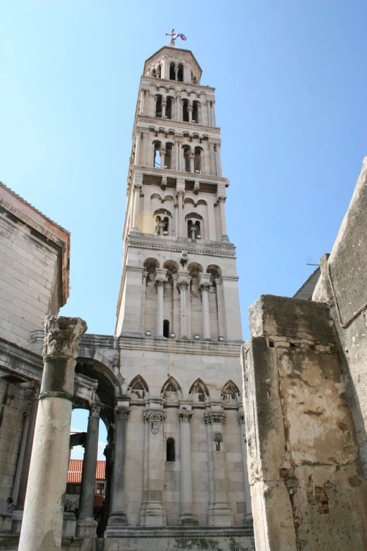 a building with a tall tower and windows in it