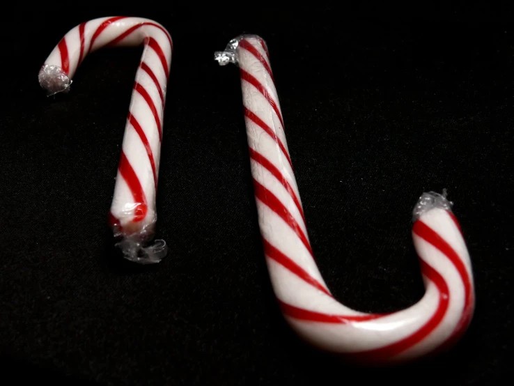 two candy canes sitting on top of a table
