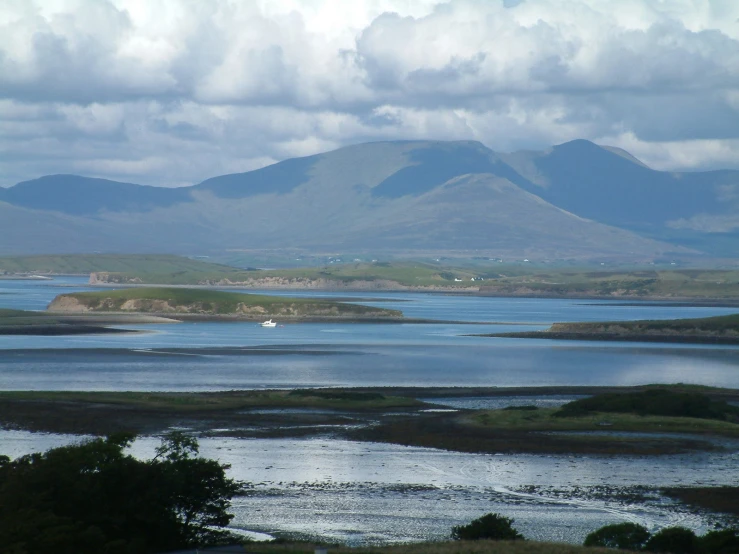 an island sits surrounded by water in the middle