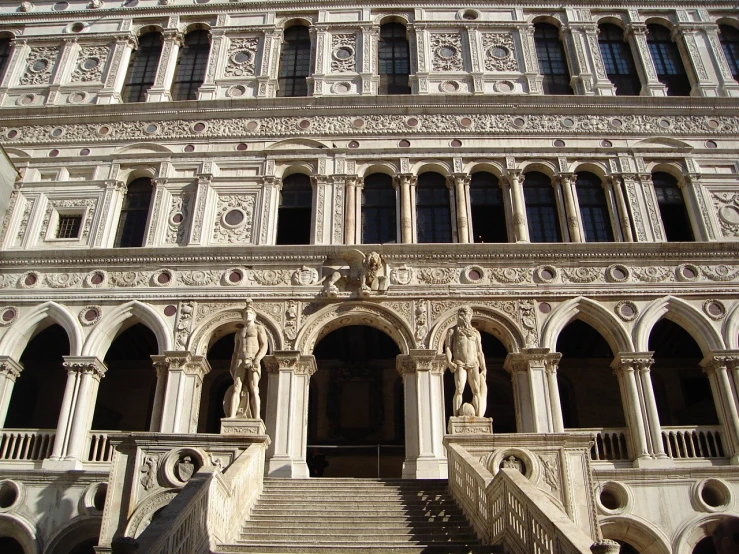 a very tall building with some stairs near it