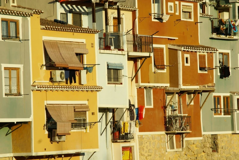 an image of various windows and balconies on buildings