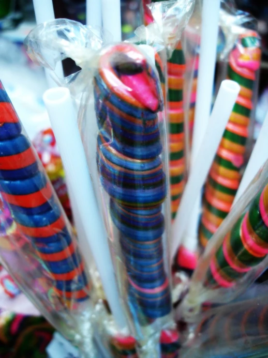 a bunch of candy sticks wrapped in celloid wrapper