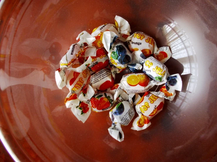 a large bowl filled with different kinds of candy