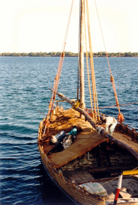 the small boat is moored on the water