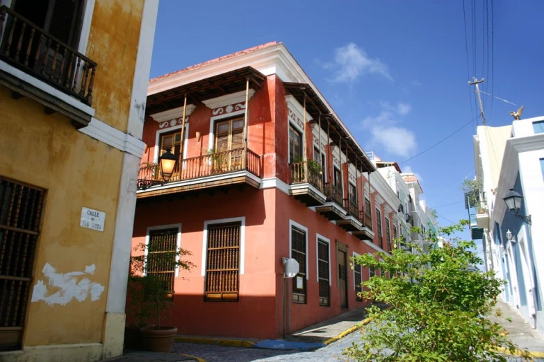 a house with some windows and an iron railing