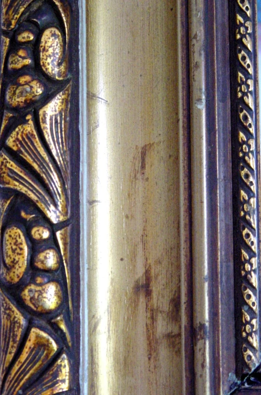 the picture shows gold paint on the wood with intricate carvings