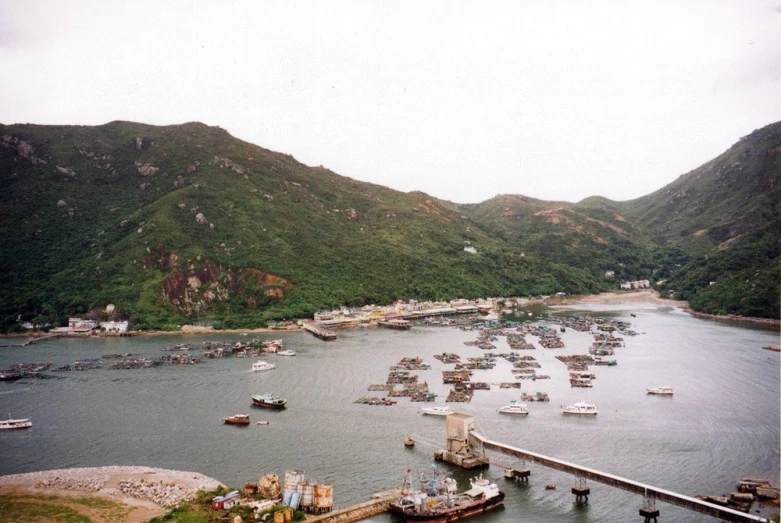 a harbor filled with lots of boats on top of a hill