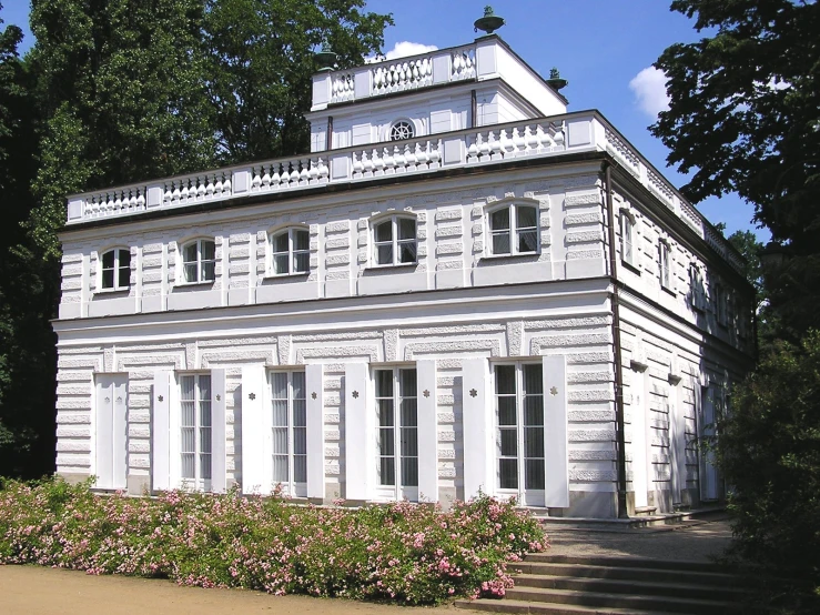 a white house with white and brown windows