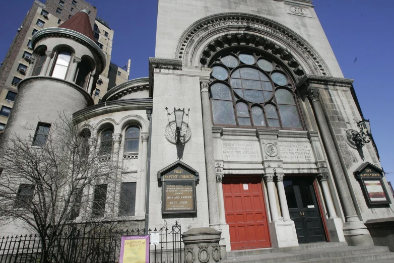 an old church with lots of windows and a clock tower