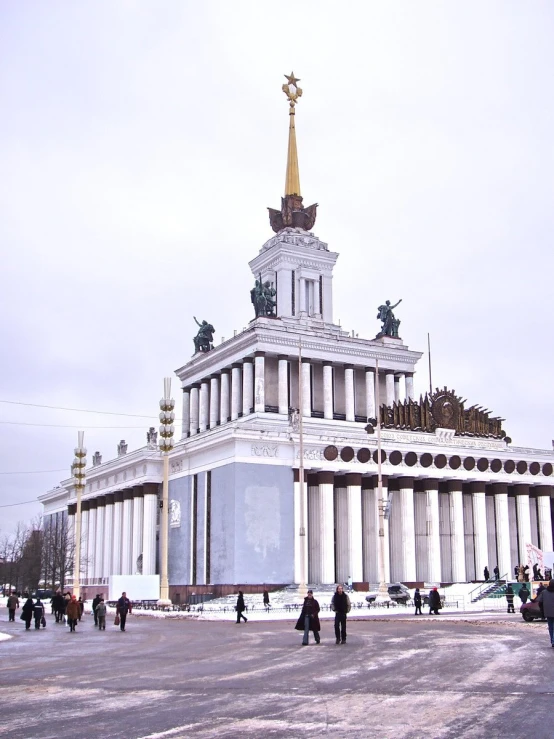 the building is decorated with many pillars and gold statues